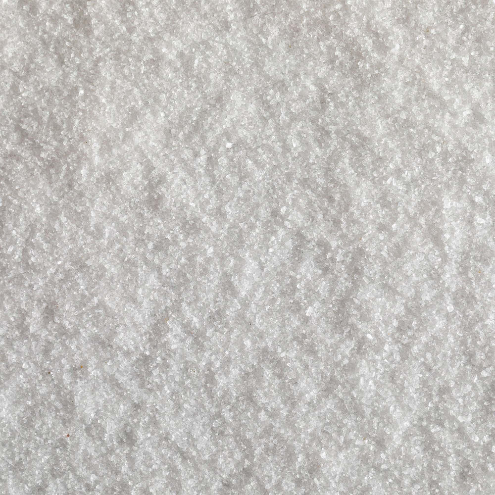 Jacobsen Salt Co. Fine-grain sea salt on kitchen counter ready for cooking or baking.