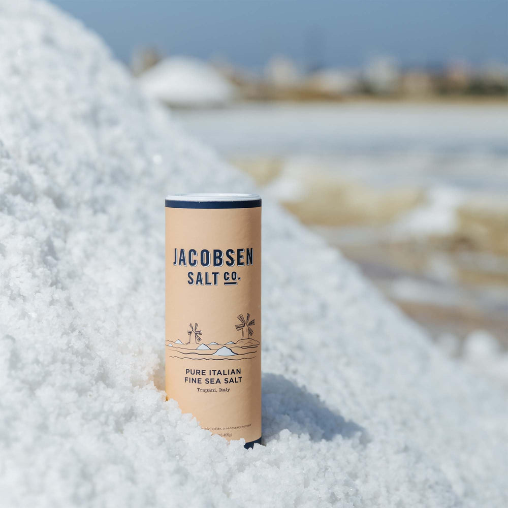 Jacobsen Salt Co. Italian sea salt crystals in a shaker demonstrating versatile seasoning.
