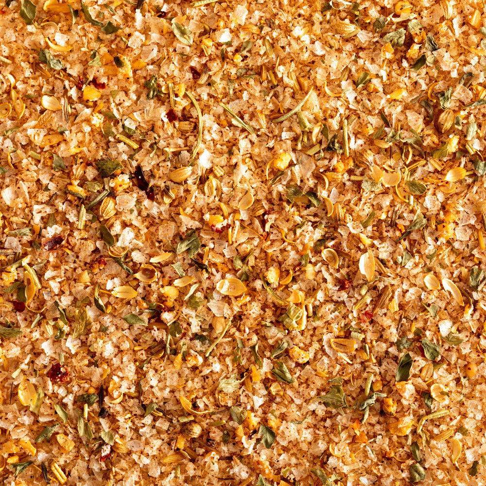 Jacobsen Salt Co. steak seasoning on a sizzling steak during grilling.