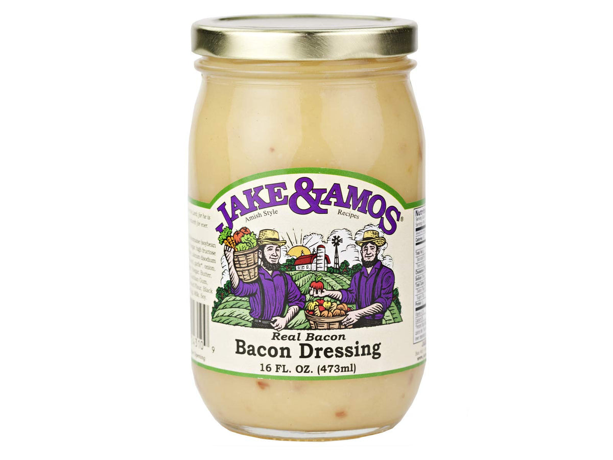 Jake & Amos Real Bacon Dressing poured over greens for savory enhancement