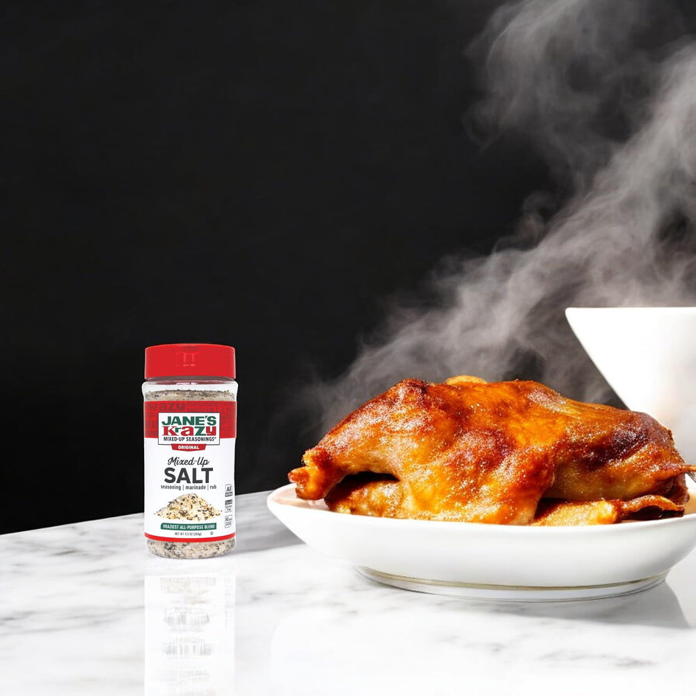 Jane's Krazy Mixed-up Original Salt Blend seasoning on grilled chicken.