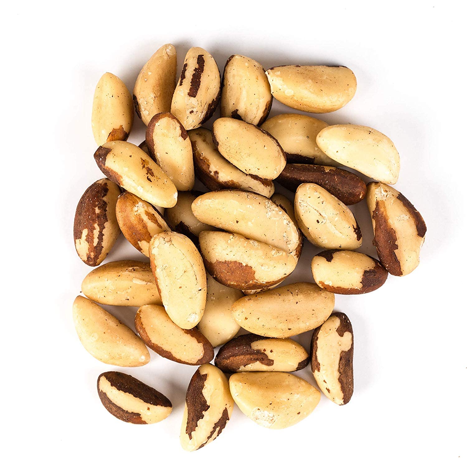 Fresh Brazil nuts in a reusable jar sit on a kitchen counter.