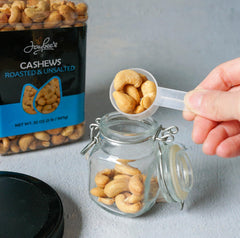 Cashews poured from Jaybee's jar, ideal for trail mixes and baking.