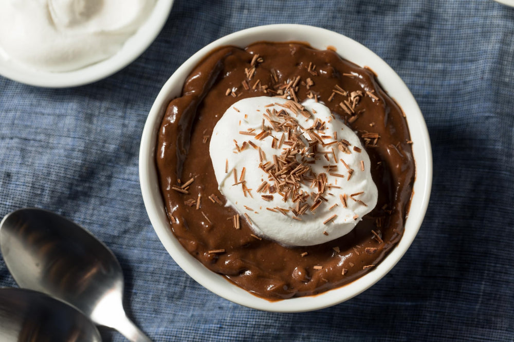Jell-O pudding topping poke cakes with a glossy chocolate layer.