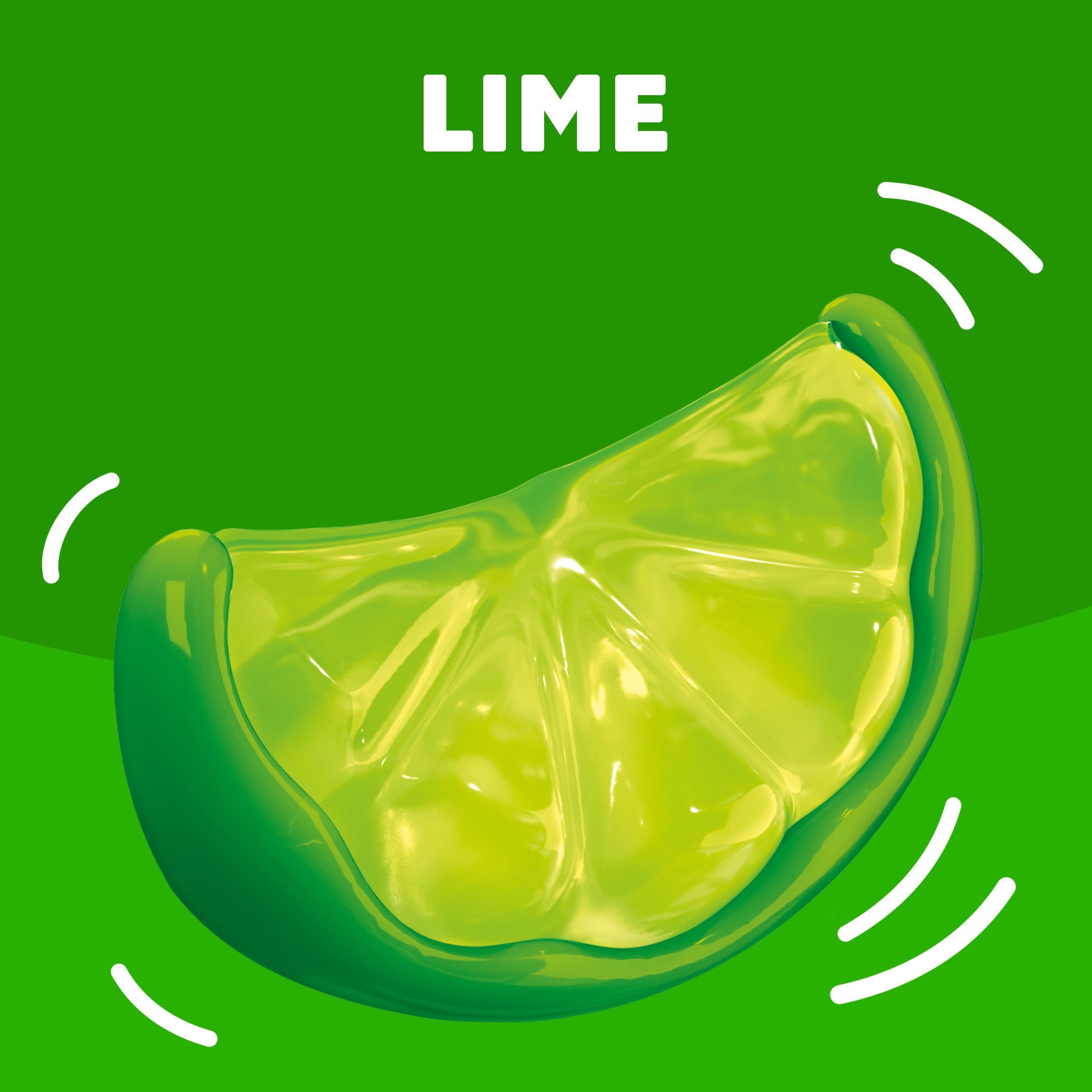 Stirring lime gelatin until completely dissolved for a smooth texture