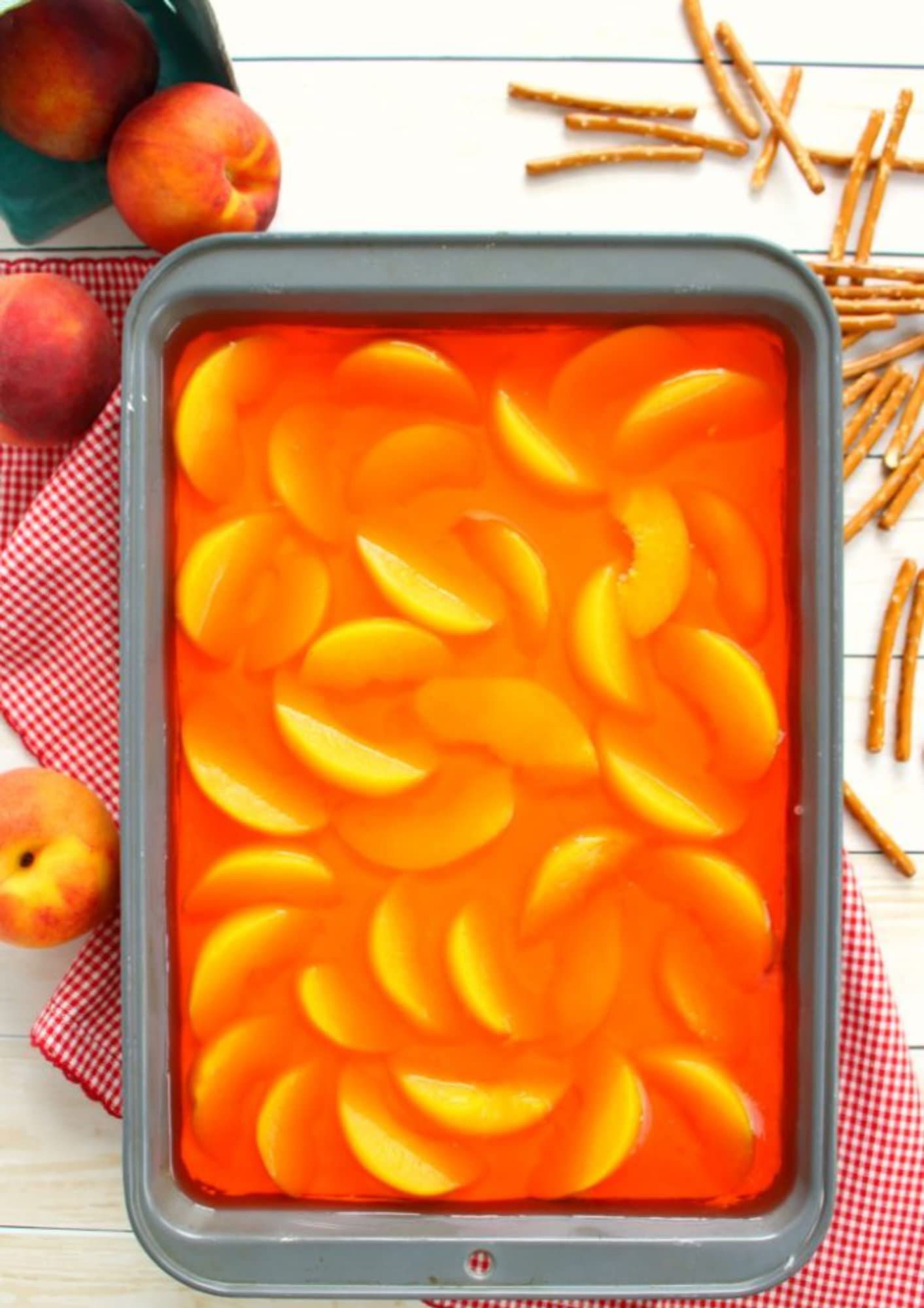 Jell-O Peach Gelatin Dessert on a kitchen table for easy entertaining.