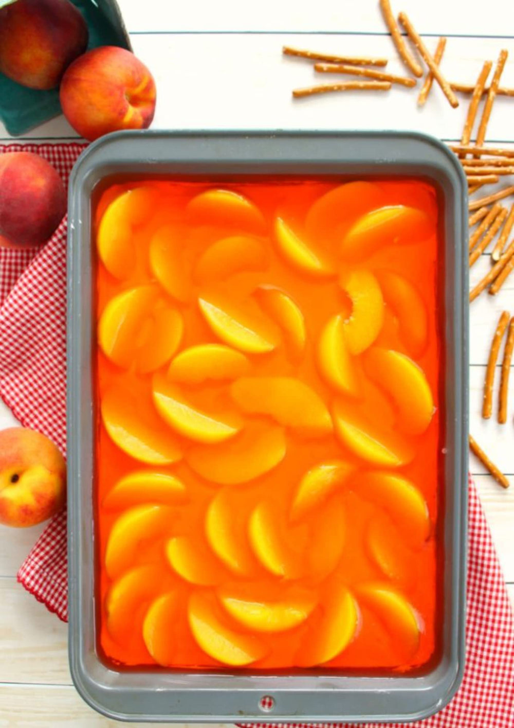 Jell-O Peach Gelatin Dessert on a kitchen table for easy entertaining.