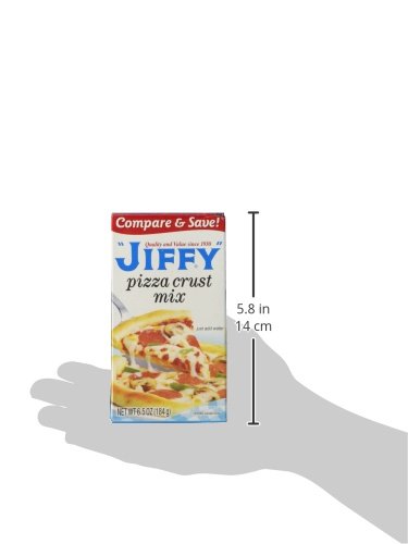 Baked Jiffy pizza crust on baking sheet with crisp edges