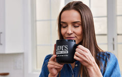 Jim's Organic Coffee Hazelnut steaming cup, enjoy a balanced aroma.