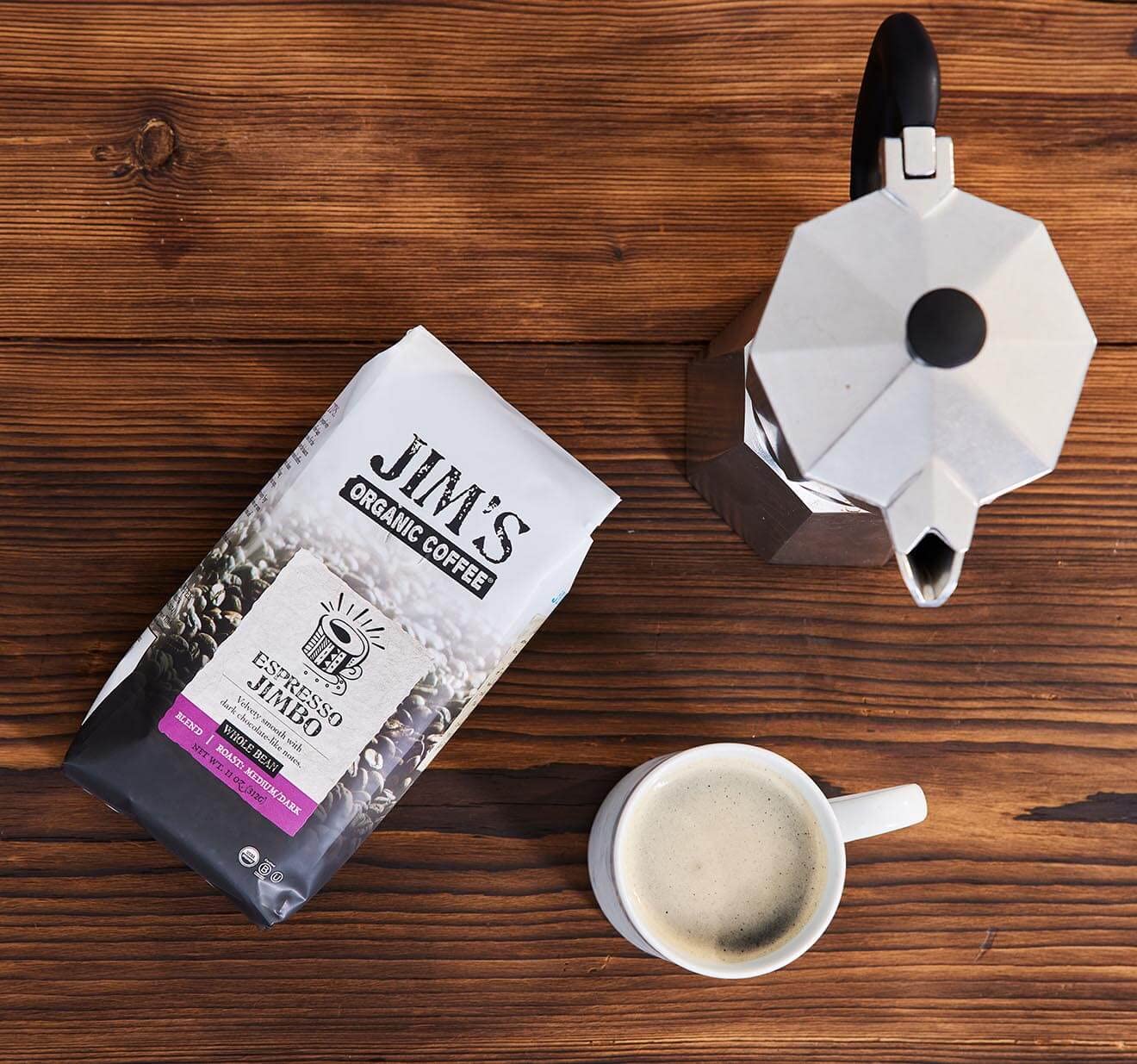 Jim's Organic Coffee label on the bag emphasizes shade-grown, ethically sourced beans