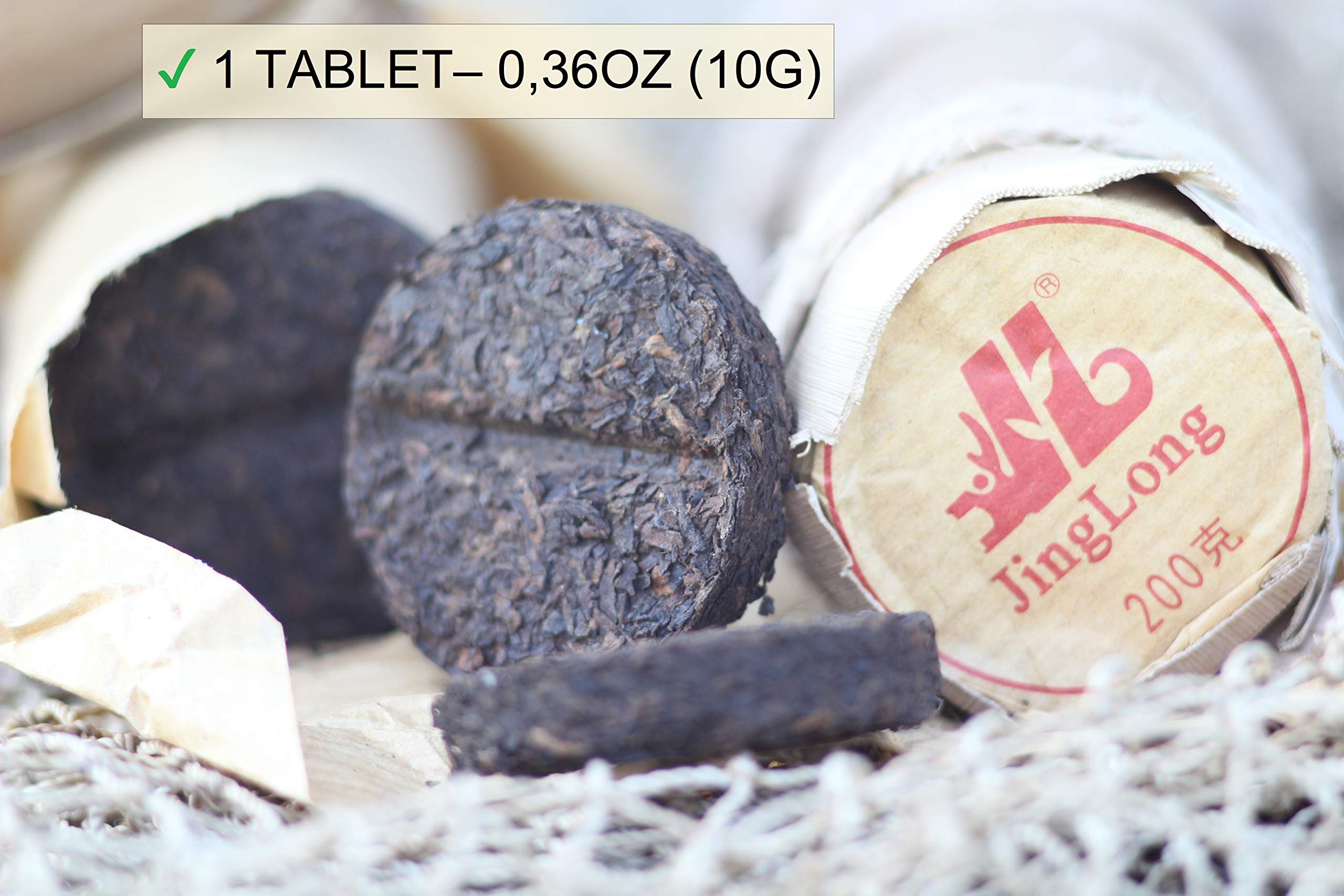 Steeped Pu-erh cup prepared from pressed Jinglong tea cake.