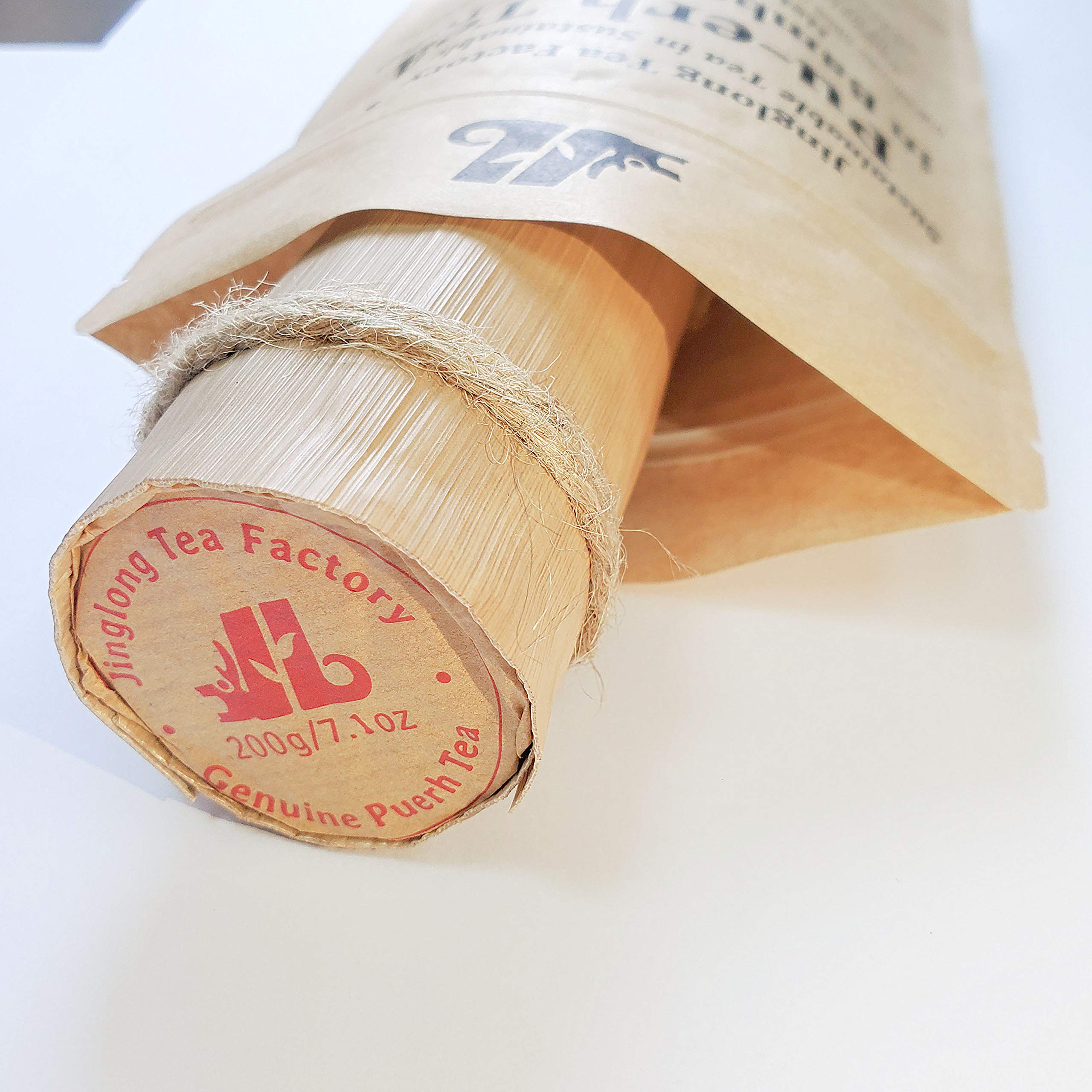 Compact pressed cake from Jinglong Tea Factory ideal for travel.