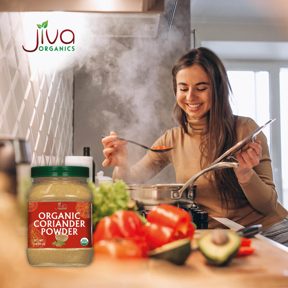 Powder being scooped into a spoon for recipe prep with Jiva Organics.