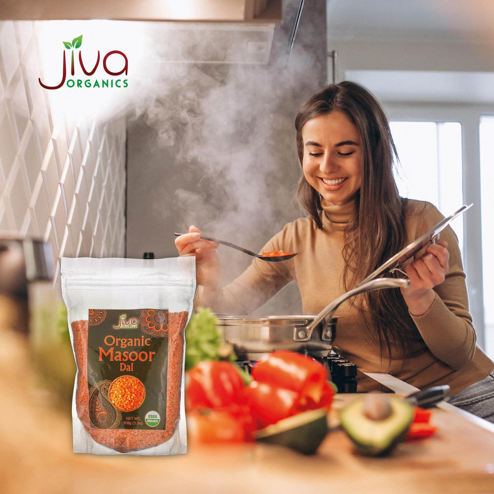 Curry with Jiva Organics Masoor Dal and spices in a vibrant kitchen.