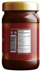 Jiva Organics Tamarind paste pouring, ready to brighten stir-fries and noodles.