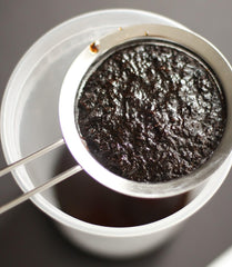 Close-up of JL Gourmet Imports vanilla bean paste texture with real vanilla specks