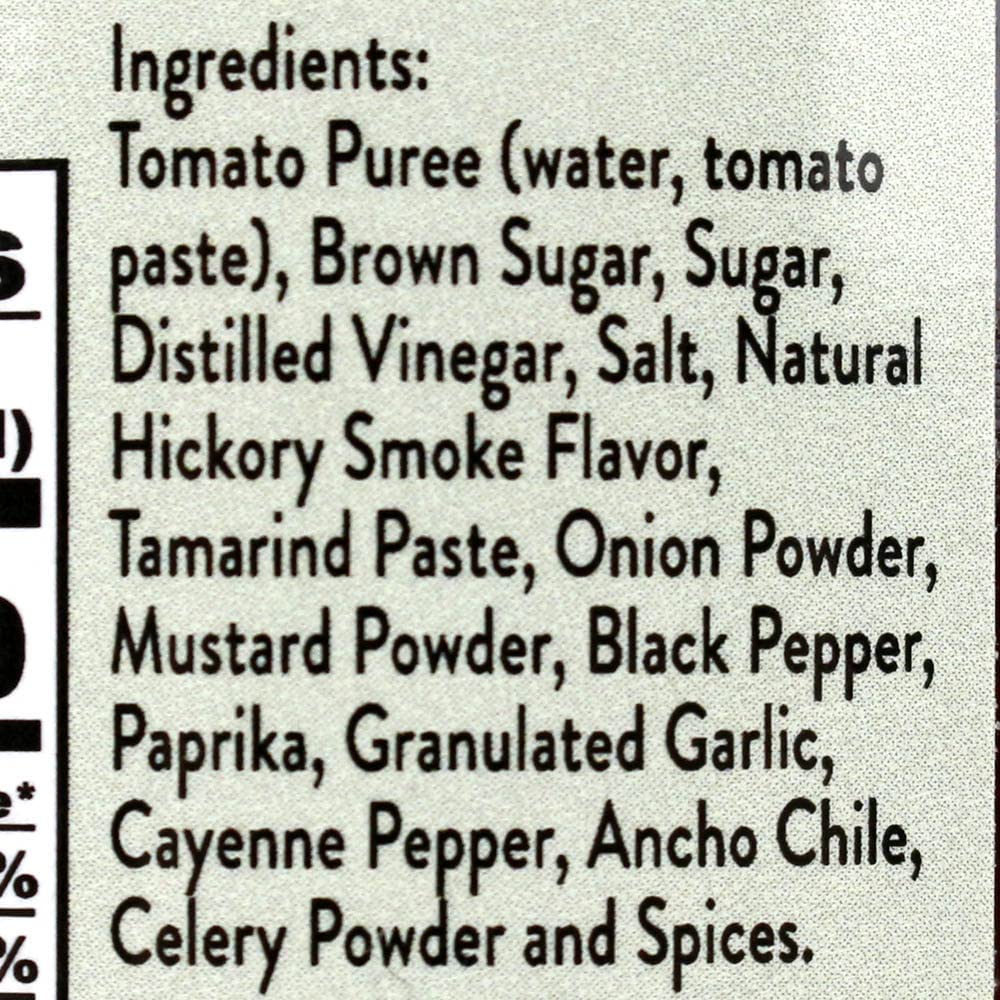 Close-up glaze of Joe's Kansas City BBQ sauce on ribs showing glossy caramelized finish