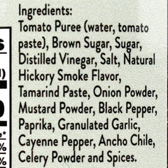Close-up glaze of Joe's Kansas City BBQ sauce on ribs showing glossy caramelized finish