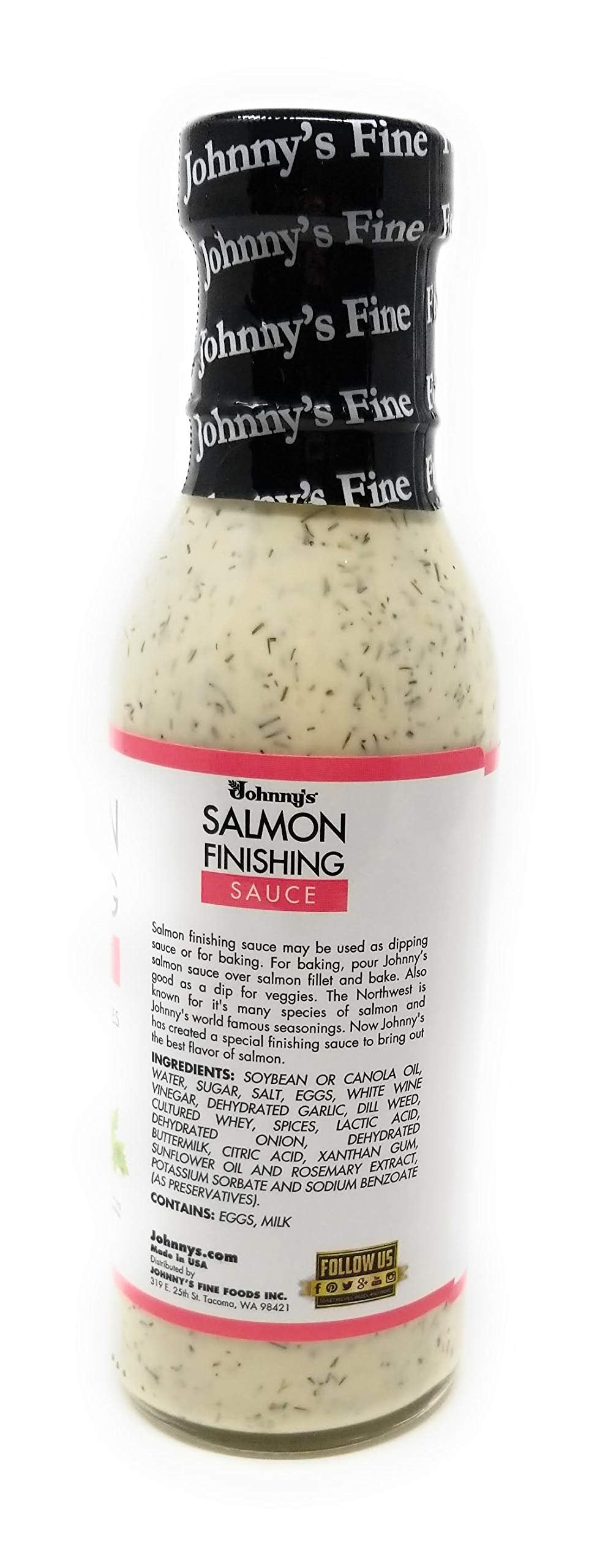 Plated salmon finished with Johnny's sauce for a creamy herb touch.