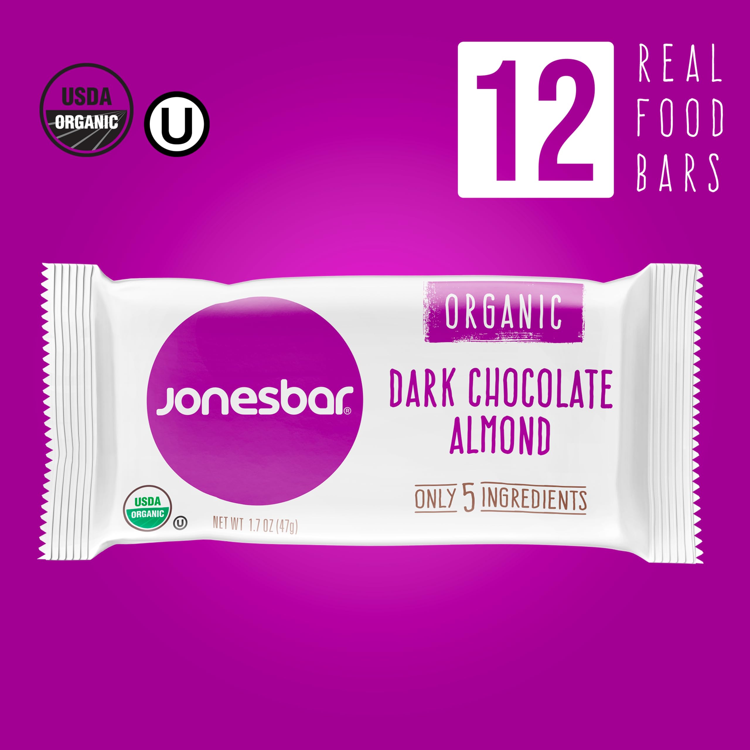 Jonesbar dark chocolate almond bar cross-section reveals chewy texture and mix of ingredients.