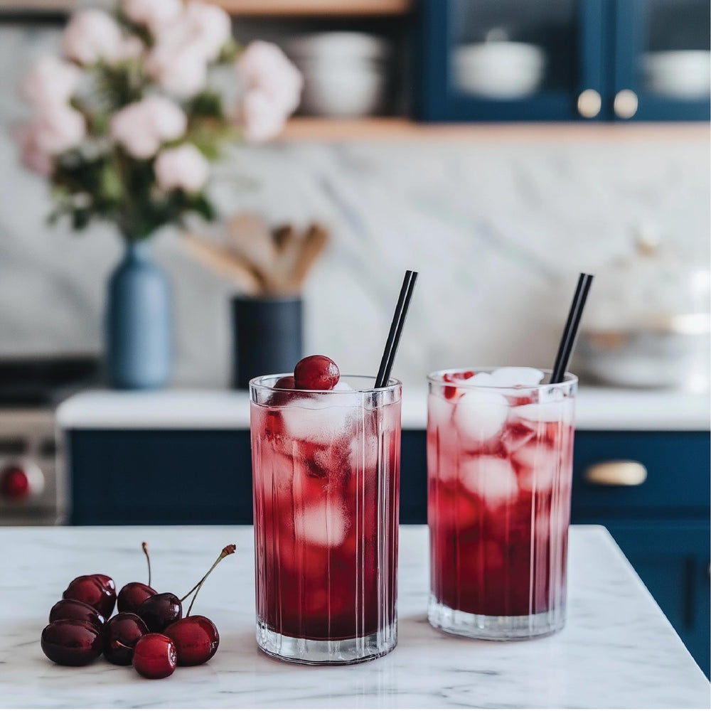 Mixing Cherry Cola syrup into a cocktail for a flavorful mocktail base