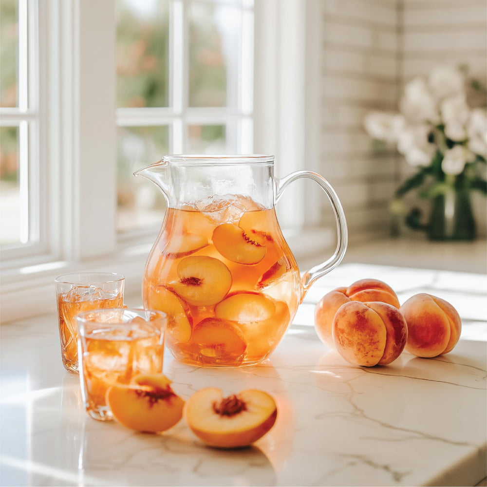 Open bottle of Jordan's Skinny Mixes Peach Tea Syrup over a drink setup