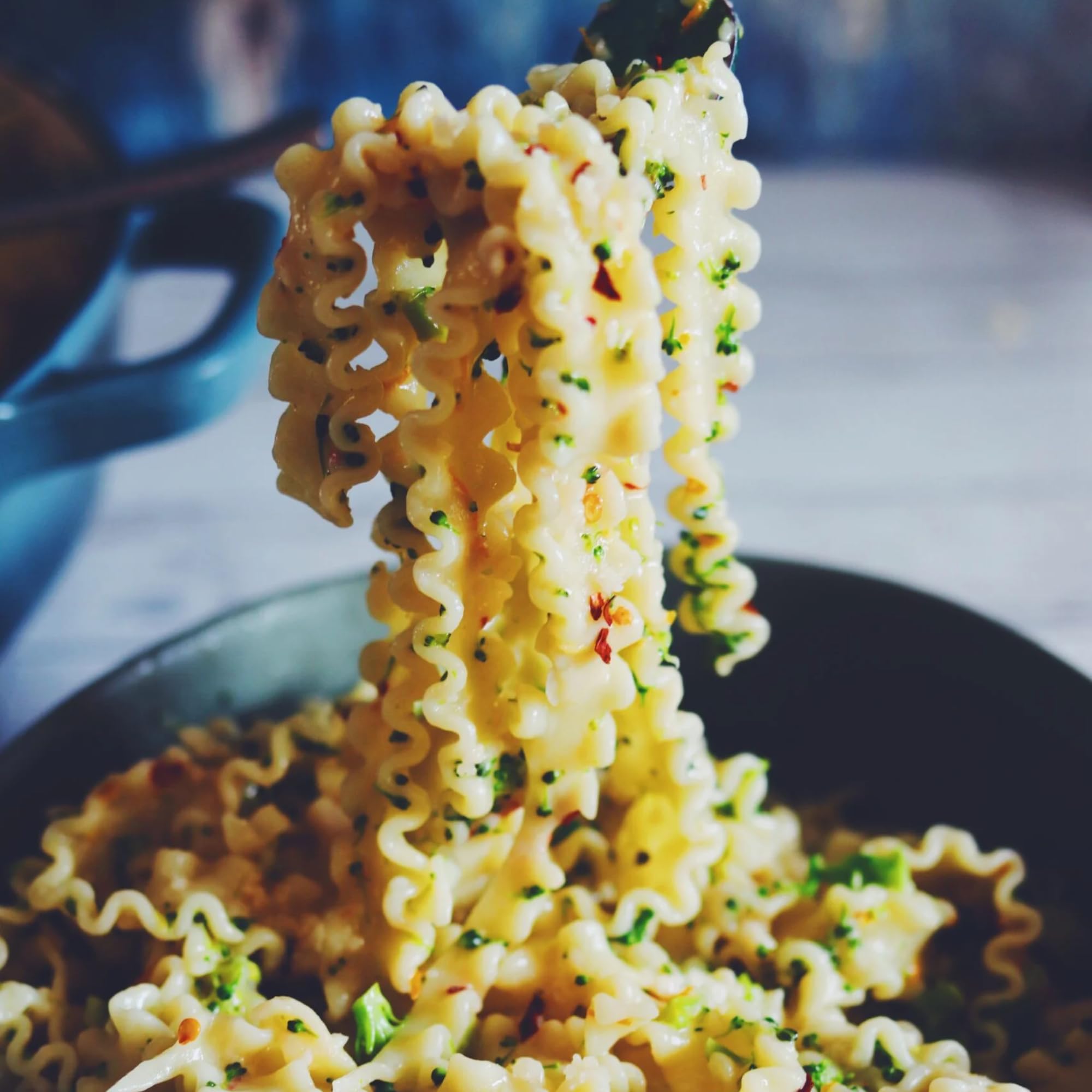 Jovial brown rice Mafalda boiling in pot for quick dinner.