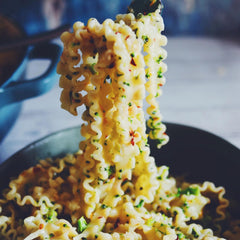 Jovial brown rice Mafalda boiling in pot for quick dinner.