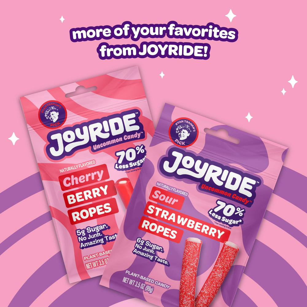 JOYRIDE Sour Strawberry Ropes being held as an on-the-go snack.