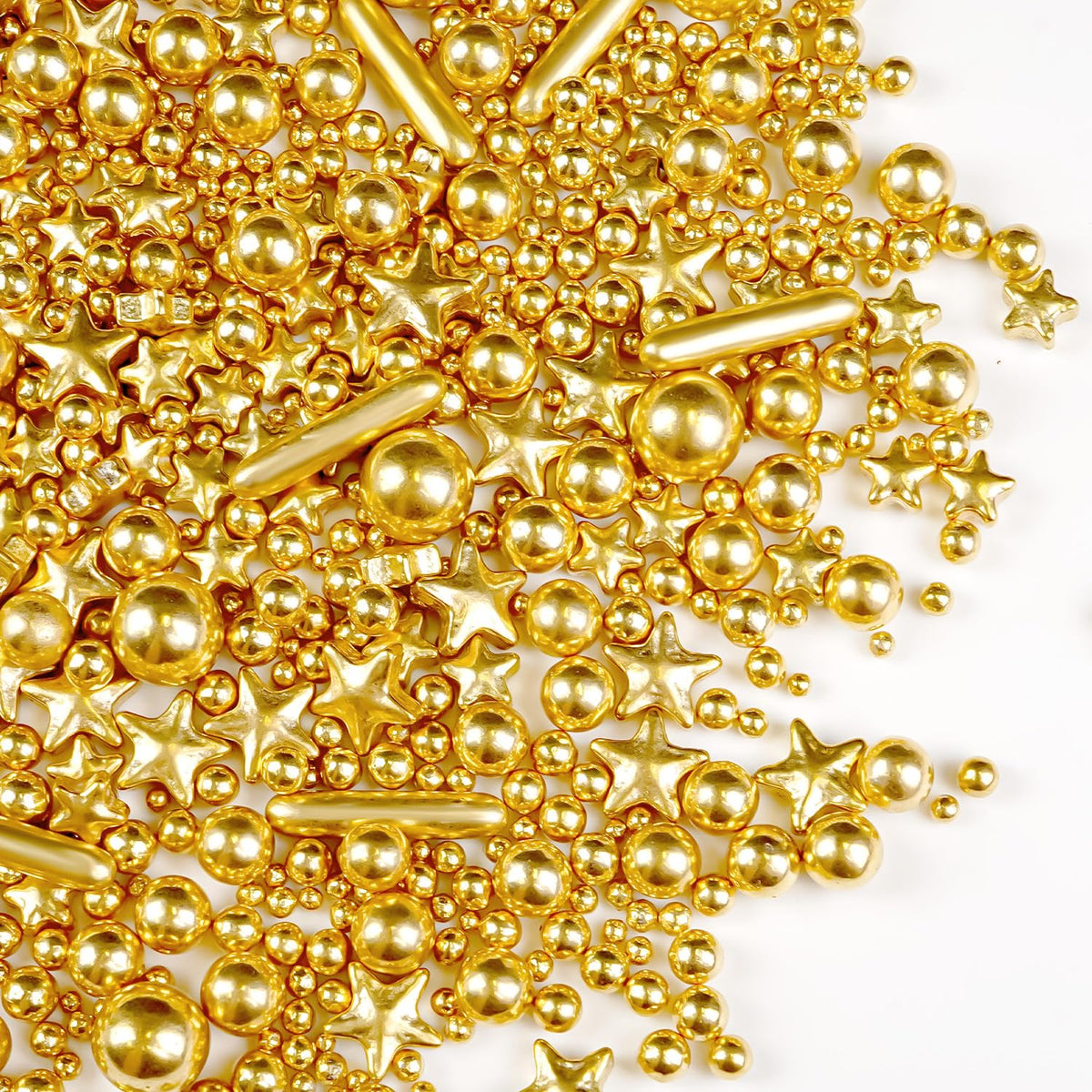 Joyvitas Gold Pearl Star Rods Sprinkles on cake for shimmering finish.