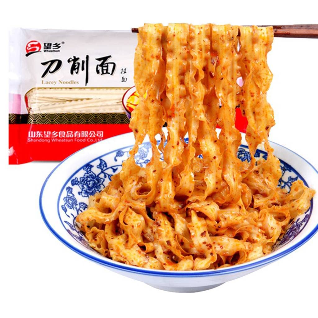 JTEDZI knife-cut noodles plated with sauces and toppings.