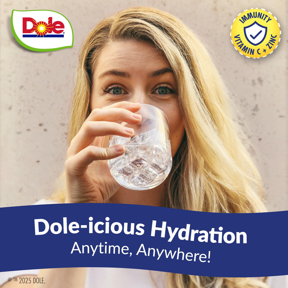 Juicy Mixes Tropical Splash Dole bottle on table, family-friendly flavor ready
