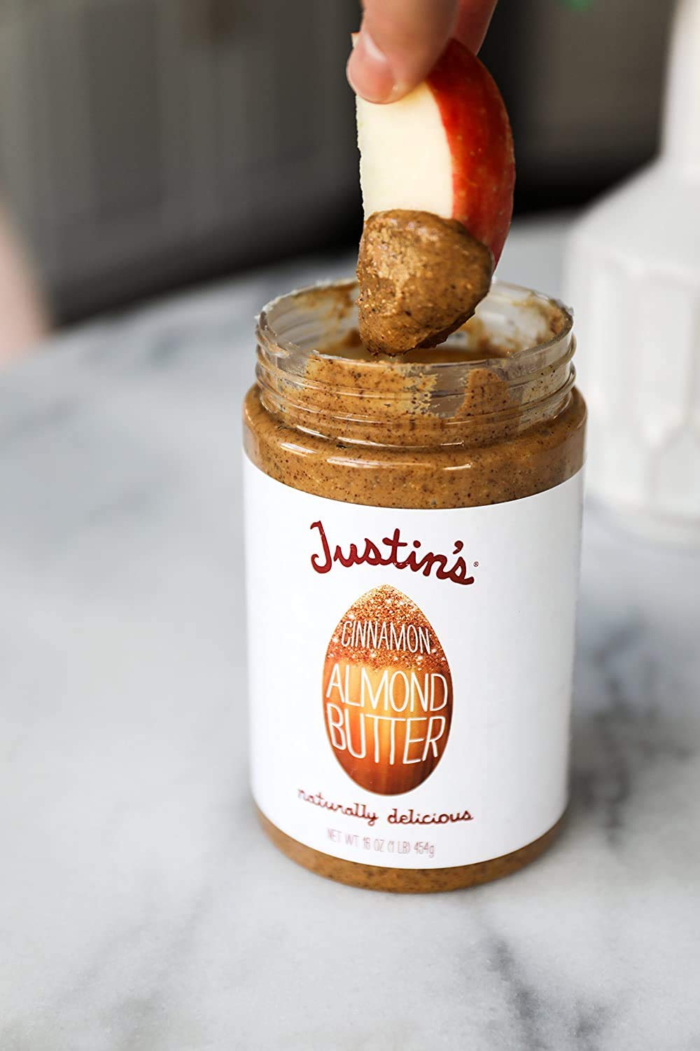 Justin's Almond Butter Cinnamon pantry scene with jars organized for easy access.