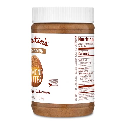 Justin's Almond Butter Cinnamon spoon scooping a dollop for a quick energy boost.