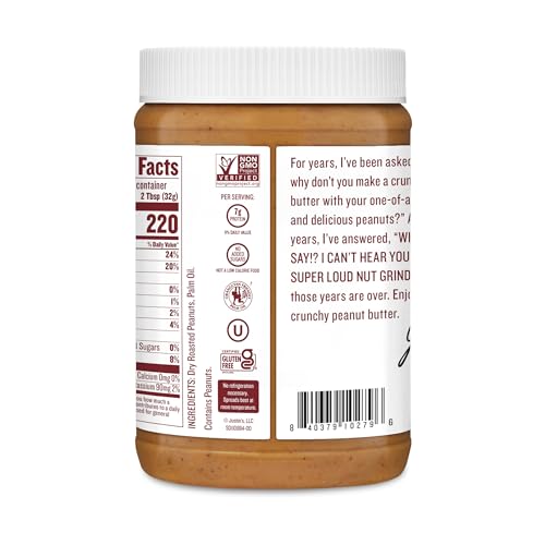 Justins Butter Peanut Crunchy being scooped, ideal for baking and toppings.