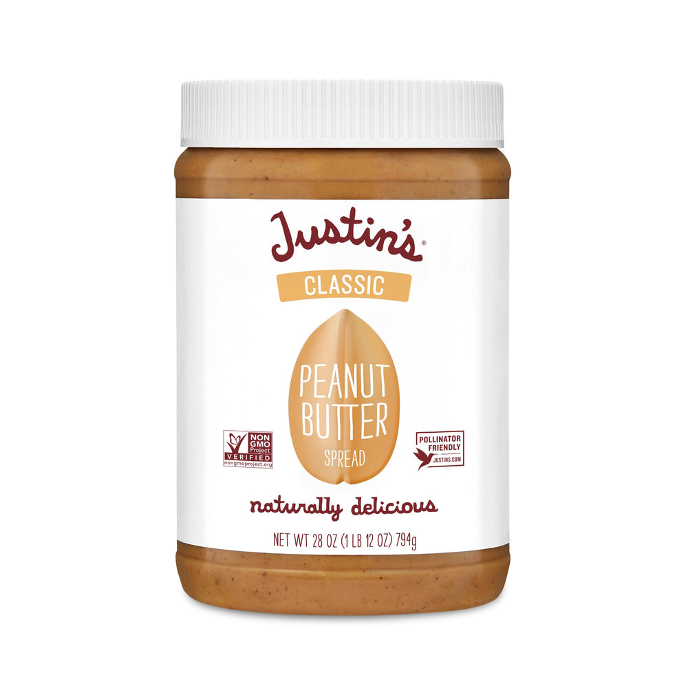 Justin's Classic Peanut Butter Jar on kitchen counter, smooth texture for quick snacks.