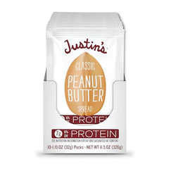 JUSTIN'S squeeze pack with peanut butter on apple slices, healthy snack option.