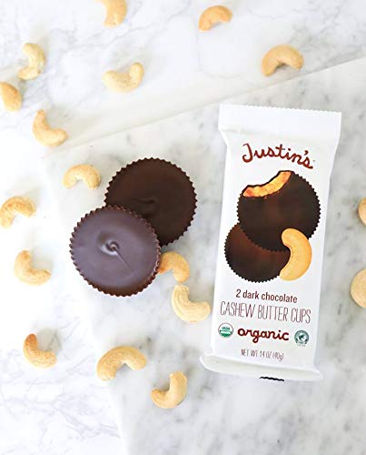 Justin's cups on a tray highlight gluten-free, non-GMO qualities for mindful eating.