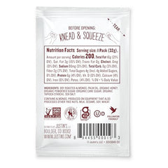Justin's Natural Honey Almond Butter squeeze pack hero shot with creamy texture