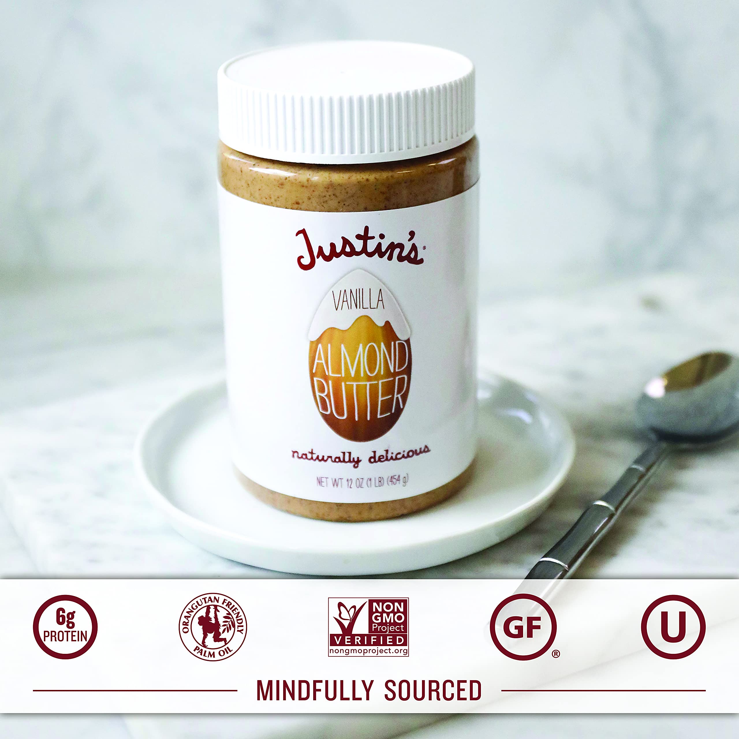 Justin's Vanilla Almond Butter spoon shot highlights rich flavor and smooth spreadability.