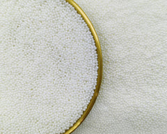 KANDLRIK white 2mm pearls for cupcakes add subtle shine and texture.