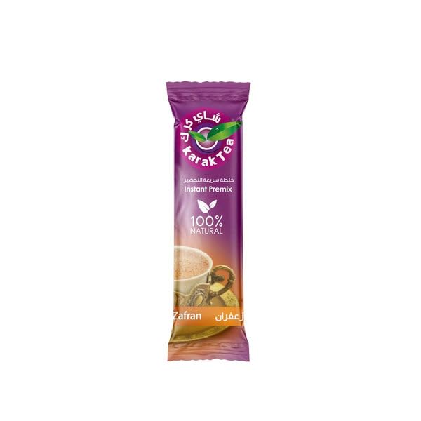 KARAK TEA premix being stirred in a cup for smooth taste