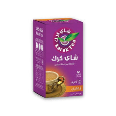 Dissolving KARAK TEA premix sachet in hot water for creamy latte