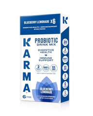 Karma Probiotic Hydration Stick stirred into water for a refreshing flavor release.