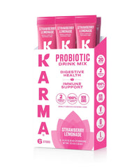 Karma Probiotic Hydration Strawberry Lemonade stick on desk for on-the-go gut support