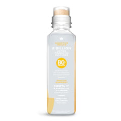 Pouring Karma Probiotic Water into a glass for refreshing hydration.