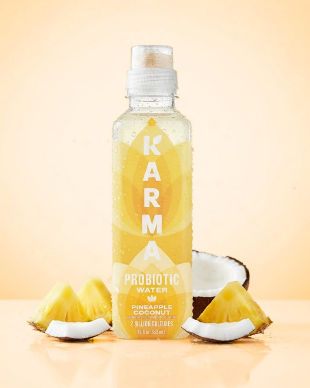 Vitamin icons on Karma bottle indicate A, E, B vitamins for daily wellness.