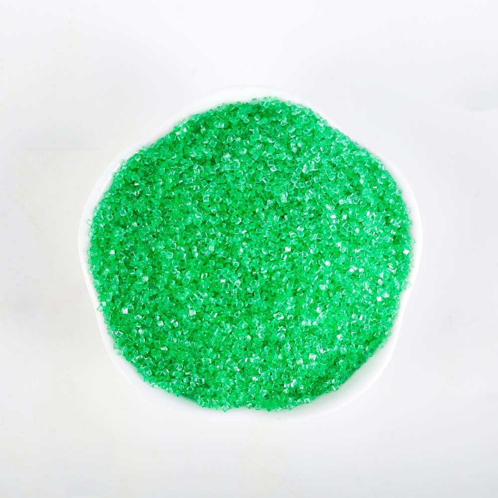 Kasvan Green Sanding Sugar crystals – versatile topping for baking and treats.