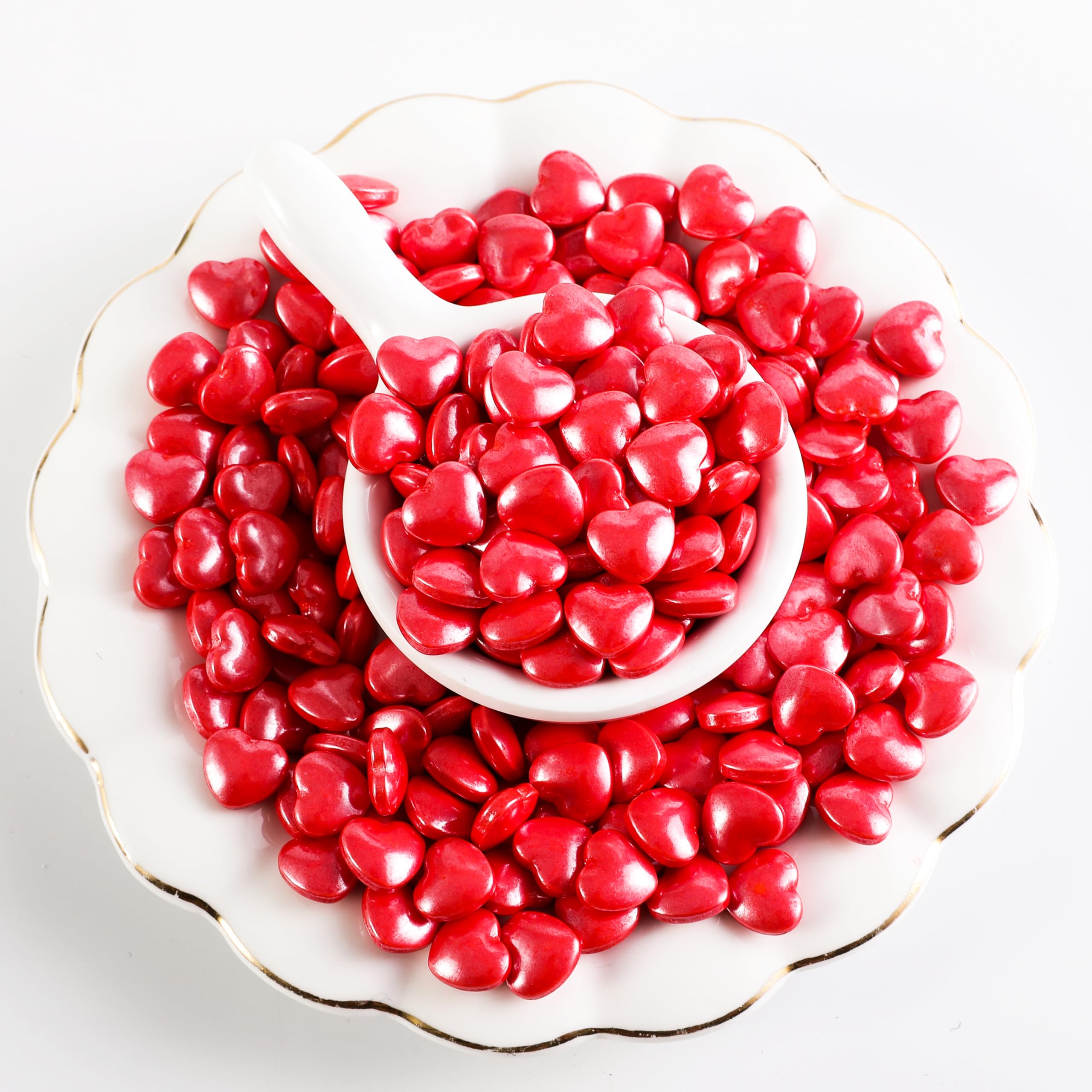Kasvan heart sprinkles on a cake providing a glossy festive finish