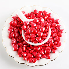 Kasvan heart sprinkles on a cake providing a glossy festive finish